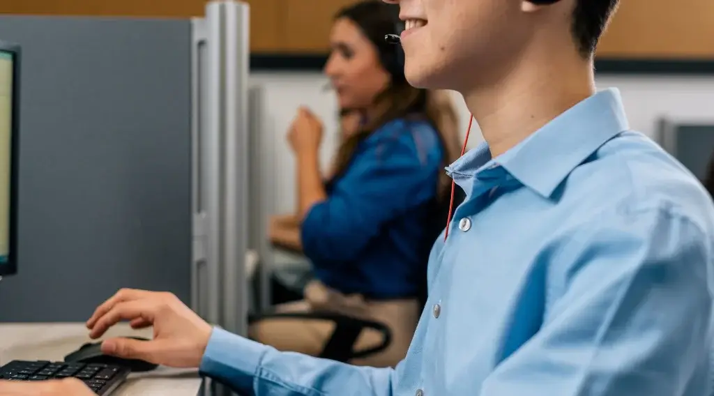 Customer service BPO agents collaborating in a mid-size operation